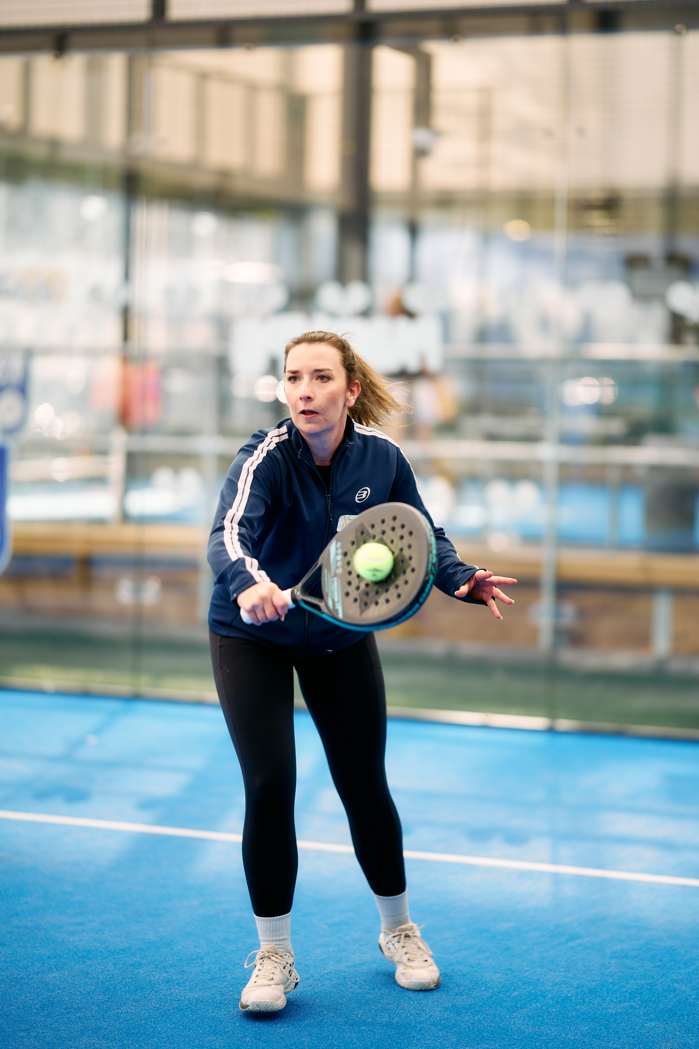 Player volleying the ball at the net