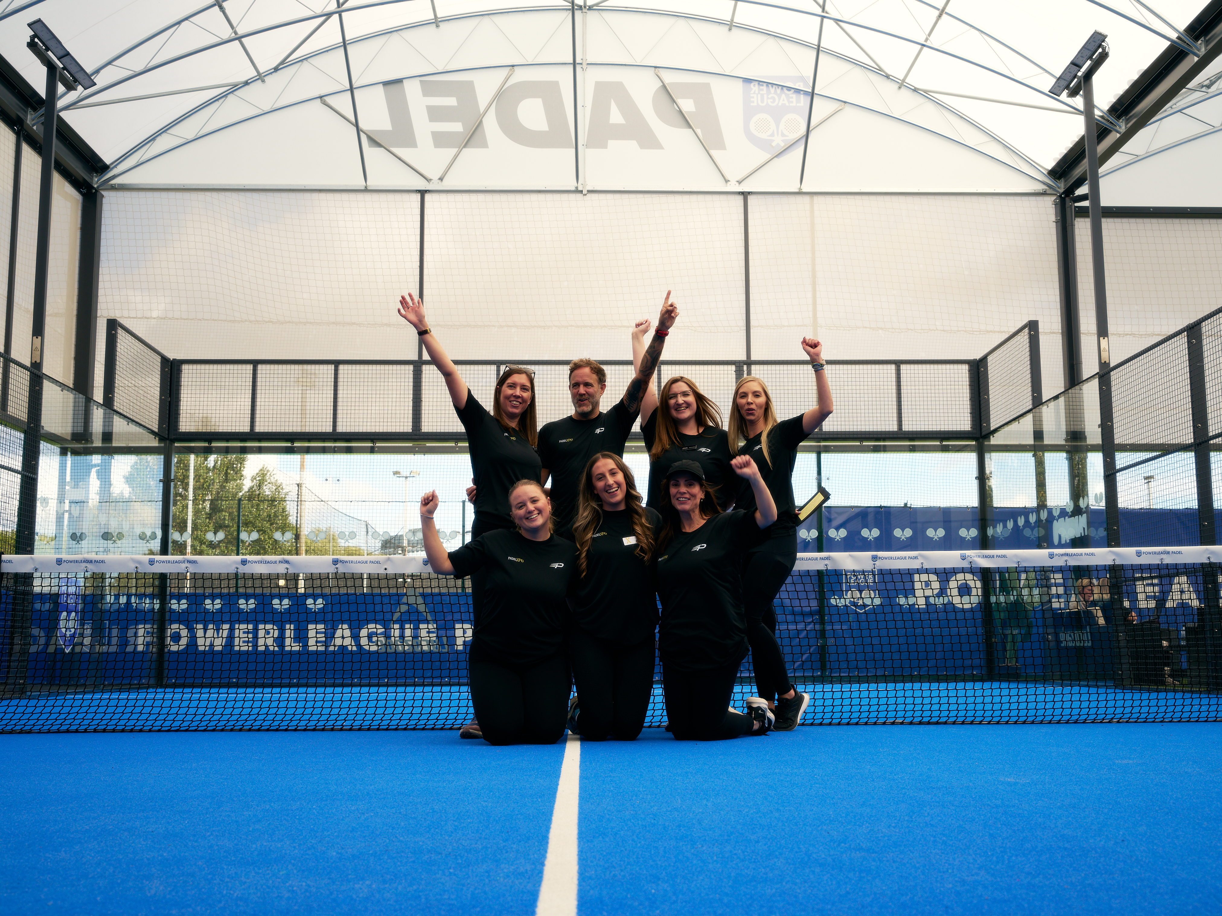 PadelXPO team celebrating together on court