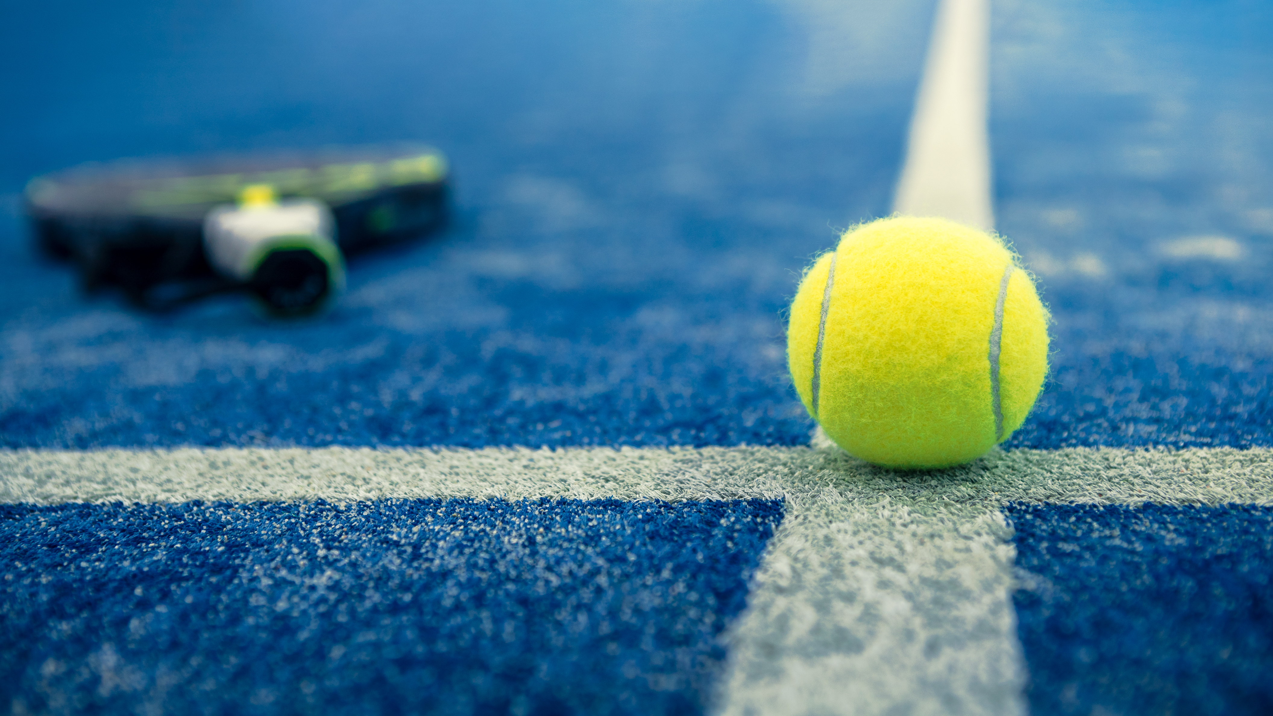 padel racket and ball